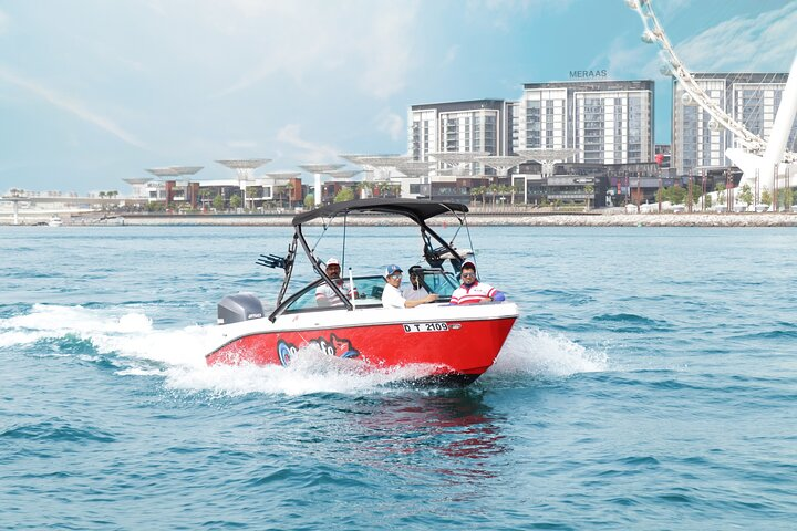 Experience an exhilarating boat ride across Dubai's stunning waters surrounded by modern architecture and shimmering seas. Perfect for families and friends seeking unforgettable moments.